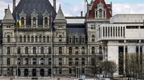 A partial view of the New York state Capitol building, left, is shown next to the state Appellate court building in foreground, right, Monday, April 4, 2022, in Albany, N.Y. A panel of five mid-level New York appellate judges have ruled on Thursday, April 21, 2022 that state Democrats engaged in gerrymandering when drawing new congressional district boundaries for the next decade.