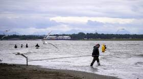 Dipnetters seek sockeye salmon at the mouth of the Kenai River in Kenai, Alaska, on July 13, 2026.