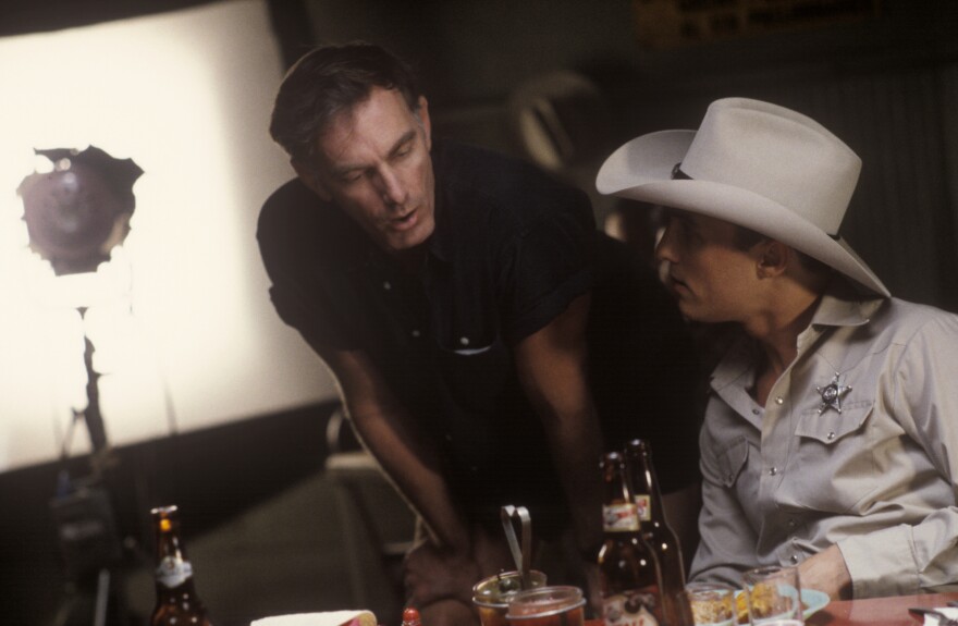 Behind the scenes, director John Sayles confers with Matthew McConaughey as Buddy Deeds on the set of "Lone Star."