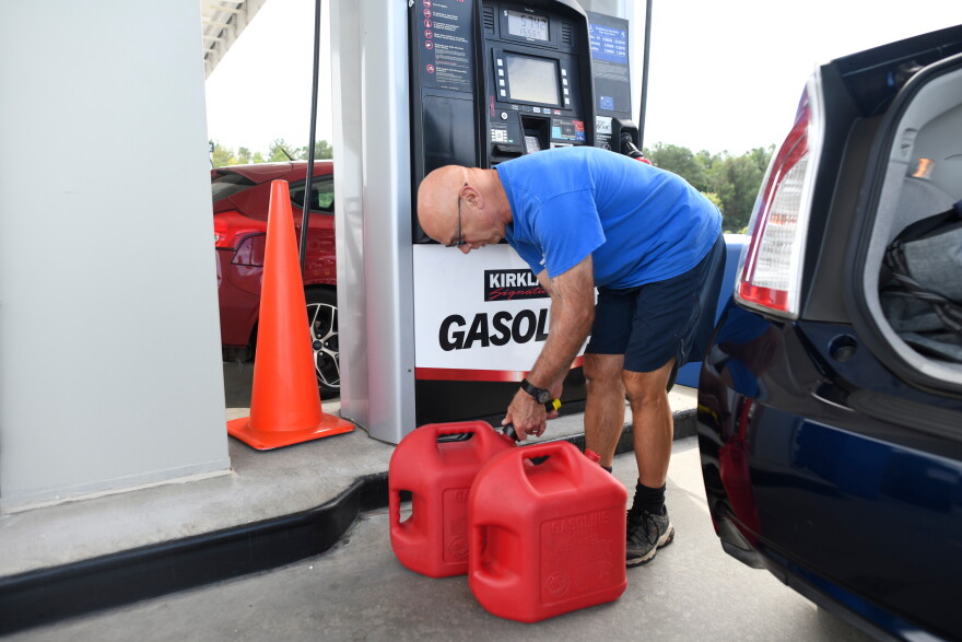 Residents fill up their gas tanks at the Costco Wholesale Gas Station ahead of Hurricane Isaias' expected landfall along the Gulf Coast, Thursday, Oct. 8, 2026, in Mobile, Ala. (AP Photo/Octavio Jones)