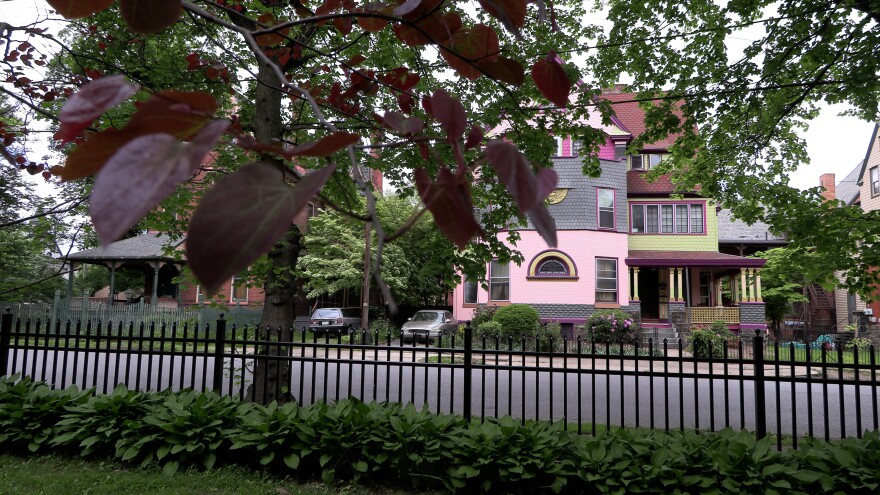 Way's Garden is surrounded by large Victorian homes on W. 4th Street, also known as Millionaire's Row Historic District.