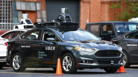 A self-driving Ford Fusion hybrid car sits parked on Aug. 18, 2016 in Pittsburgh. Uber said that passengers in Pittsburgh will be able to summon rides in self-driving cars with the touch of a smartphone button in the next several weeks. (Jared Wickerham/AP)