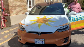 A Tesla Model Y parked outside the Palladium Theater in St. Petersburg. The car is part of the Southern Alliance for Clean Energy's electric vehicle "roadshow."
