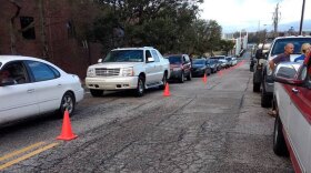 Cars lined up to get food and supplies at two distribution points in Wilmington Tuesday, Sept. 18. 