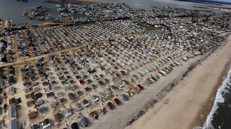 Homes are surrounded by sand washed in by Superstorm Sandy on Oct. 31 in Seaside Heights, N.J.