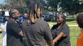 Local rappers Pusha T, left, and Fam-Lay, meet with Gwendolyn Bailey at her Norfolk home on Thursday, Aug. 22, 2024.