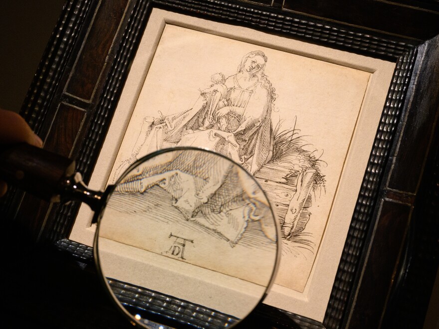 A pen and black ink drawing by Albrecht Dürer titled "The Virgin and Child with a Flower on a grassy Bench" is seen at London Art Week dealer Agnews, on Nov. 19, in London.