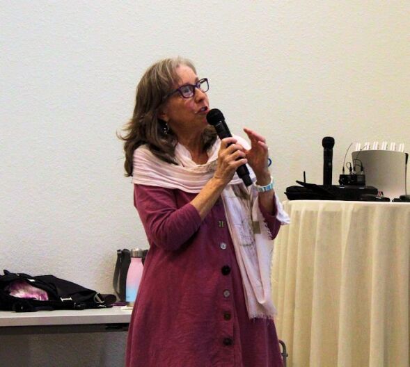 Historian Gerri Reaves shows audience 'the oldest known photograph' that in the Historical Society's archives.