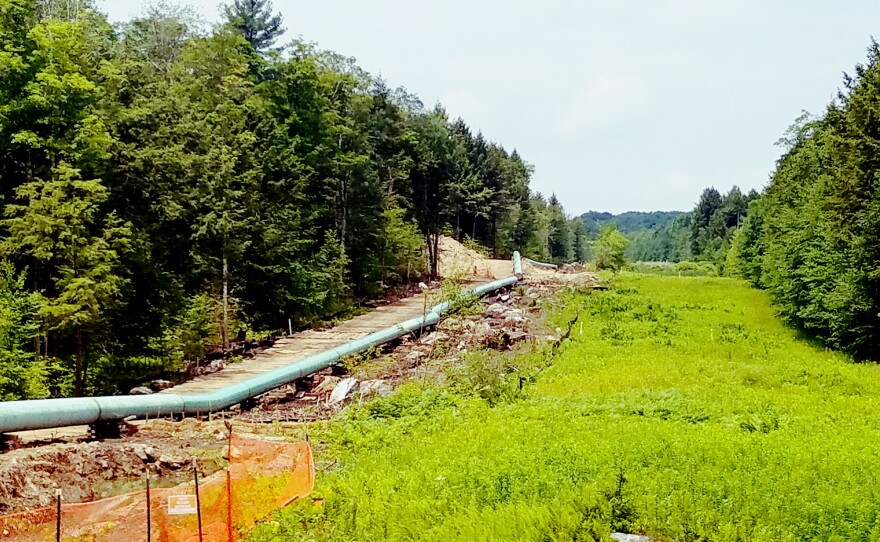 Pipes waiting to be burried along a stretch of land in Otis State Forest in Sandisfield, Mass.