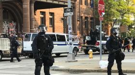Police confronted protesters in an effort to move them away from City Hall on Wednesday morning. Credit Max Schulte / WXXI News