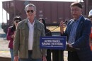 High‑Speed Rail Authority CEO Ian Choudri, right, speaks during a news conference accompanied by California Gov. Gavin Newsom, left, at the California High‑Speed Rail Authority 150-acre Southern Railhead site in the Wasco/Shafter area as the first step in bringing in materials, starting track installation between Merced and Bakersfield, in Wasco, Calif., Tuesday, Feb.3, 2026.