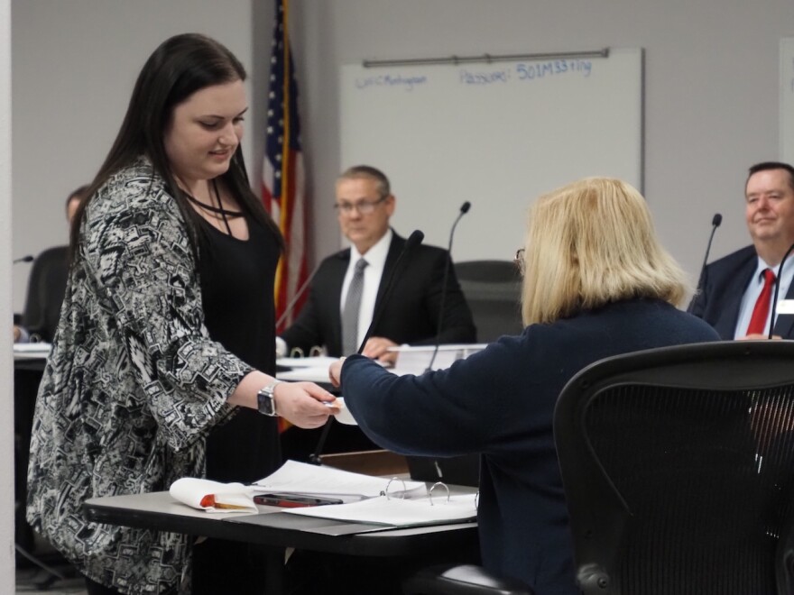 State Board of Election Commissioners staff member Aly Tate offers a selection of county names to commissioner Bilenda Harris-Ritter on Dec. 11, 2024.