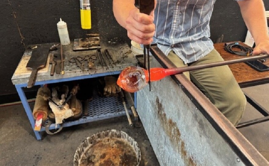 Heat in the glass art studio can reach 150-degrees