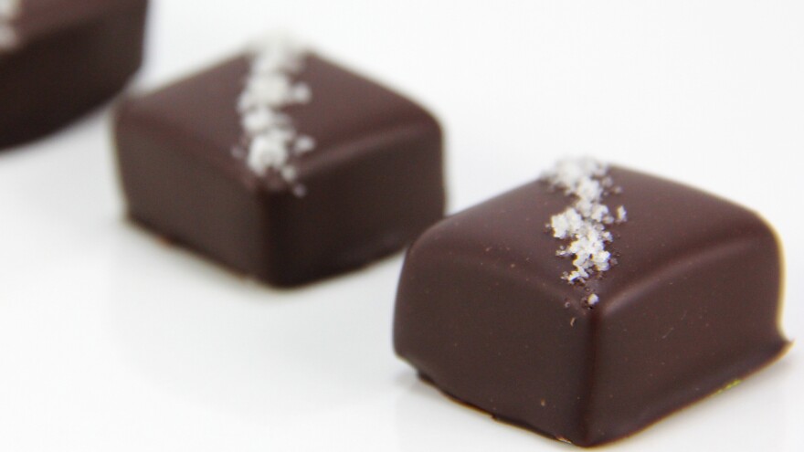 High-end salted caramel purveyor French Broad Chocolate Lounge grinds lavender buds with salt to top lavender-honey caramels.