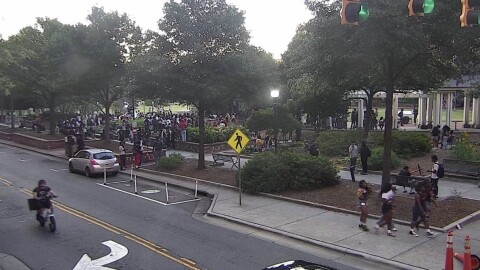 Large group of teenagers gathers in Romare Bearden Park.