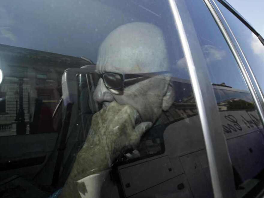 Media mogul Rupert Murdoch is driven along Whitehall in central London, Tuesday, July 19, 2011.  Murdoch and his son James Murdoch were questioned by a parliamentary committee of British lawmakers Tuesday over the phone hacking scandal.