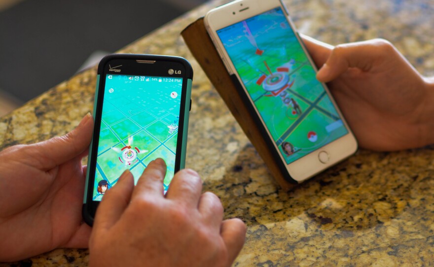 Diana Child, 48, and Will Rucker, 25, play Pokémon Go at the Suwannee Valley Players Community Theatre in Chiefland on July 11, 2016. (Kali Kavouklis/WUFT News)