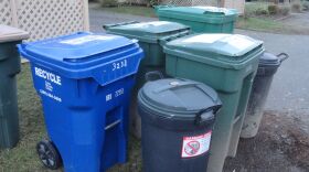 Photo of 5 garbage and recycling containers