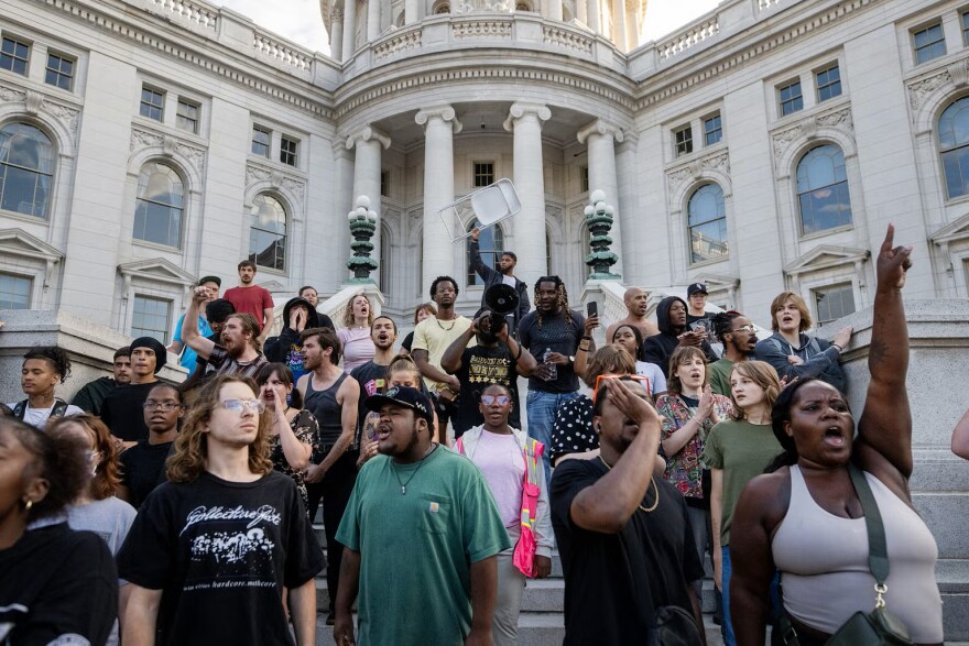 Protesters disrupt a Concerts on the Square event Wednesday, July 22, 2026, in Madison, Wis, after a Madison man was shot and killed by a police officer earlier that day.