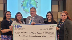 The Otoe-Missouria Tribe receives a grant check from the EPA SWIFR program for $1.5 million. In the photo from left to right are Water Quality Technician Bobbi Dove, Environmental Department Coordinator Angela Heim, Otoe-Missouria Chairman John Shotton, Network Exchange Assistant Shawna Littlecrow and Environmental Technician Malinda Wennin.