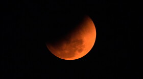 The blood moon is seen shortly after a total lunar eclipse in Guwahati, India, Tuesday, March 3, 2026. (AP Photo/Anupam Nath)