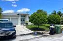 A house with a car in the drive