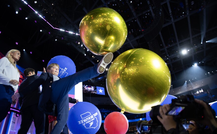 A child kicks a balloon on stage on the fourth night of the Republican National Convention in Milwaukee, Wisconsin on July 18, 2024.