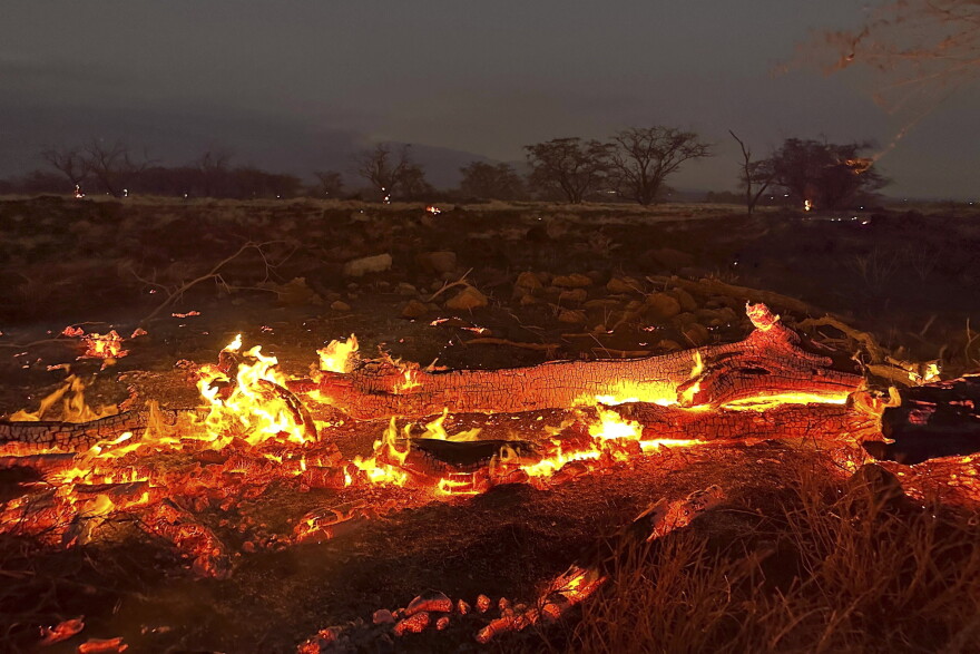 A wildfire burns in Kihei, Hawaii late Wednesday, Aug. 9, 2023. Thousands of residents raced to escape homes on Maui as blazes swept across the island, destroying parts of a centuries-old town in one of the deadliest U.S. wildfires in recent years.