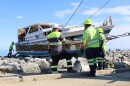 Crews prepared to hoist the vessel from Lake Michigan shoreline in early May.