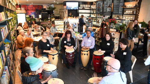 Sam Holmstock leads the Creative Exchange Meetup "Drumming Through Trauma" in Hyannis.