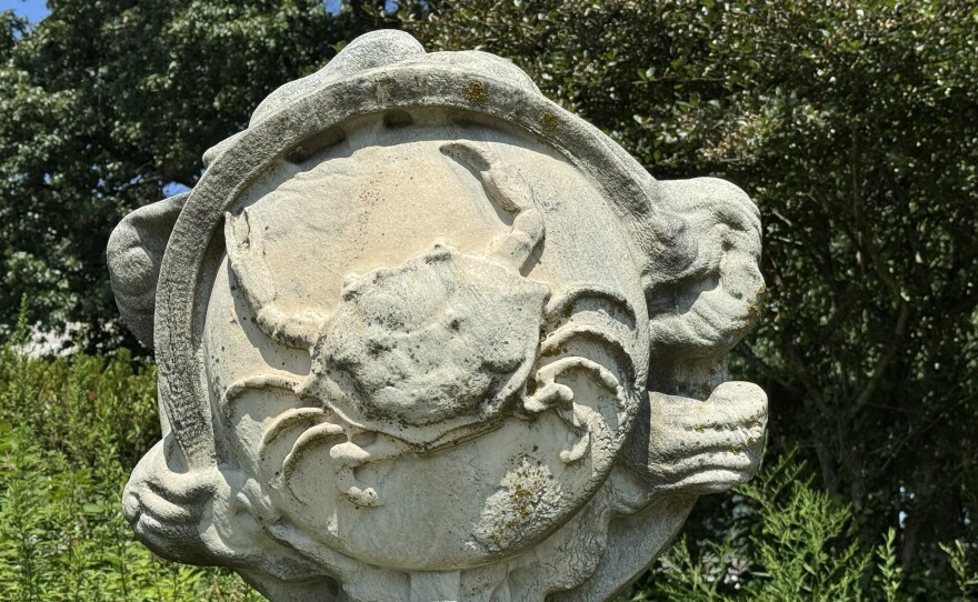 Cancer crawls on a globe in a sculpture at the Cleveland Museum of Art’s Zodiac Garden.
