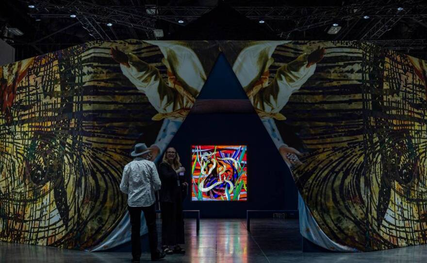 Miami Beach, FL- November 29, 2022 - Entrance to Christopher Myers’ Let the Mermaids Flirt with me, 2022 a piece consisting of stained glass light boxes, at the Meridians sector during Art Basel VIP opening day at the Miami Beach Convention Center.