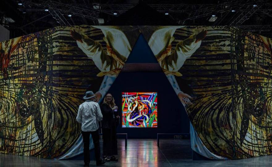 Miami Beach, FL- November 29, 2022 - Entrance to Christopher Myers’ Let the Mermaids Flirt with me, 2022 a piece consisting of stained glass light boxes, at the Meridians sector during Art Basel VIP opening day at the Miami Beach Convention Center.