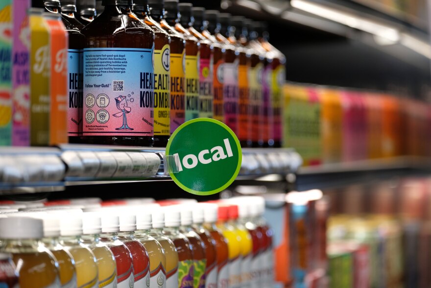 At least 20% of items at the Wasatch Food Co-op are from local producers. At the May 20, 2026, grand opening, shoppers easily found those items marked with green tags throughout the store.