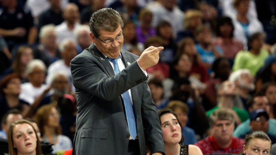 Head coach Geno Auriemma of the Connecticut Huskies calls to his players in the first half against the Notre Dame Fighting Irish.
