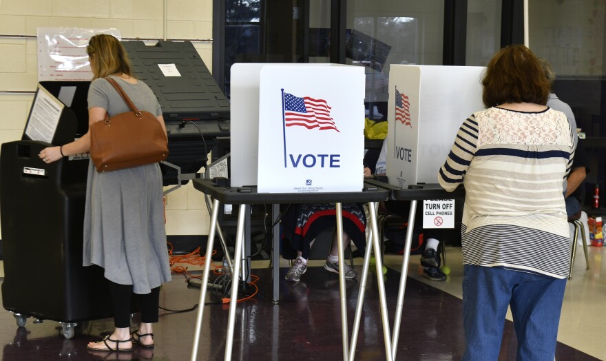 Voters cast their ballots at Cedar Grove Elementary School, Tuesday, Feb. 20, 2018, in Shepherdsville, Ky. 