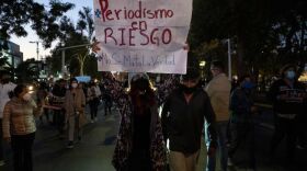 Journalists and supporters hold signs as they protest the murders of their colleagues Lourdes Maldonado and Margarito Martinez in Tijuana, Baja California, Mexico. The sign says, "Journalism at risk. Don't kill the truth."