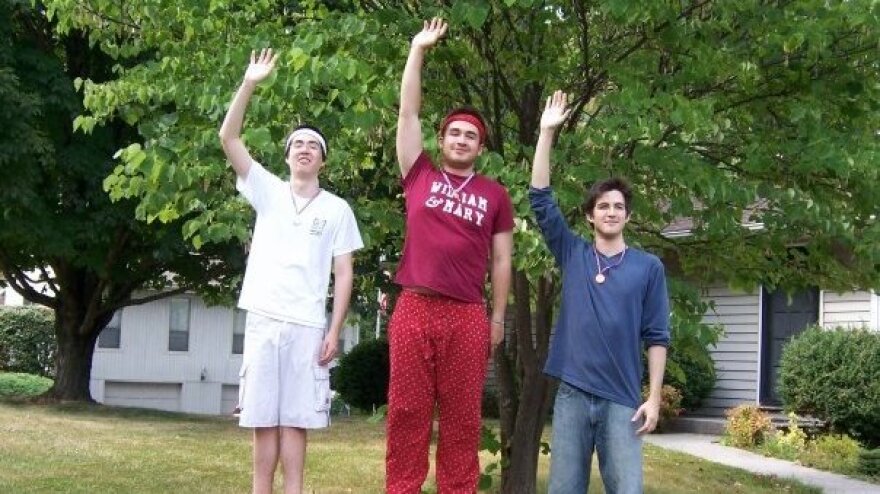 Eric Cunningham (right) with his brothers Andrew (center) and Joshua at the medal ceremony for their 2008 "Brolympics."