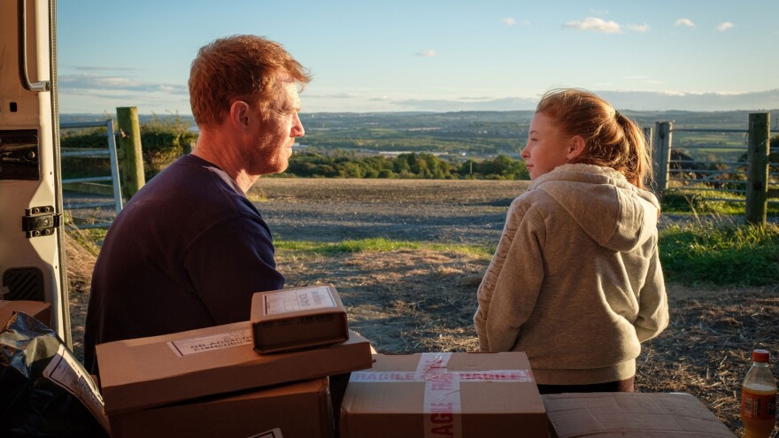 Delivery van driver Ricky (Kris Hitchen) takes a break with his his daughter (Katie Proctor) in the Ken Loach drama <em>Sorry We Missed You</em>.