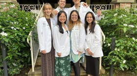Thomas Gausepohl (back right) stands with the rest of his Kauaʻi Medical Training Track cohort. This group of students is the fourth cohort since the program started in 2022.