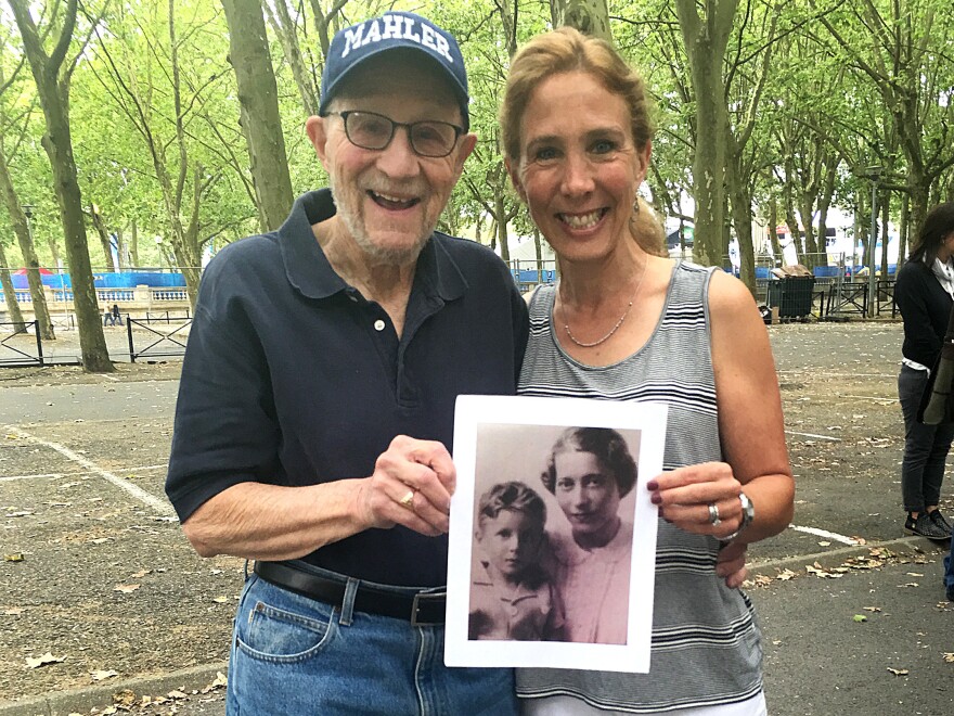 Stephen Rozenfeld and daughter Leah Sills were among those gathered to honor Sousa Mendes' memory. Rozenfeld holds a photograph showing him and his mother when he was 5, when he and his family received Portuguese visas and fled France.