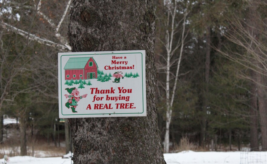 A sign thanks customers for buying a real Christmas tree Wegner's Tree Farm in Blackberry on Dec. 16, 2024.