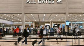 Passenger are heading to the security checkpoint at the Kansas City International Airport the Monday before Thanksgiving.