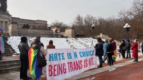 Organizer Marissa Ireland addresses dozens of rally-goers on the steps of Kentucky's capitol.