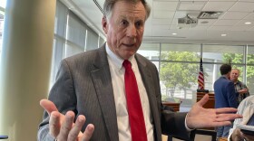 In this file photo, North Carolina Insurance Commissioner Mike Causey talks to reporters at the Albemarle Building in Raleigh, N.C. Greg Lindberg and John Gray were among four people indicted in 2019, accused of trying to give $1.5 million to Insurance Commissioner Mike Causey’s election campaign in exchange for the removal of an insurance official who would be in charge of regulating Lindberg’s company. (AP Photo/Hannah Schoenbaum)