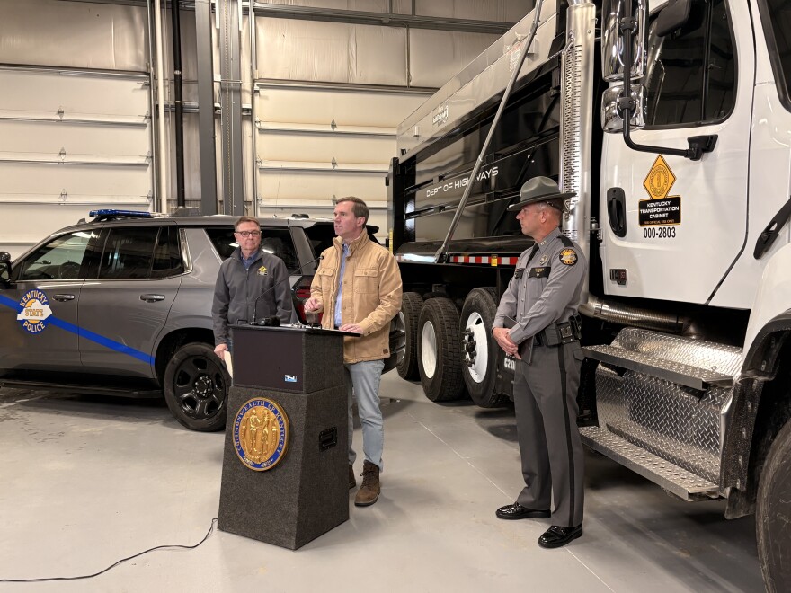 Secretary Jim Gray, Governor Andy Beshear, and Kentucky State Trooper Bryan Washer.
