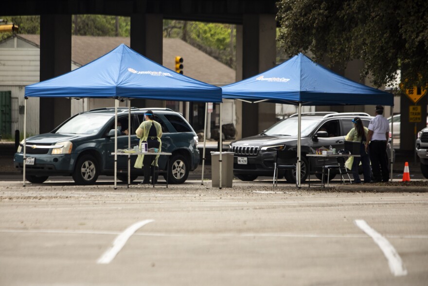 CommUnityCare conducts drive-thru COVID-19 testing at the Hancock Center.