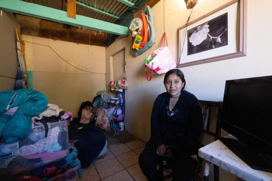 Woman and child sits in room