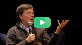Ken Burns on stage / green play button