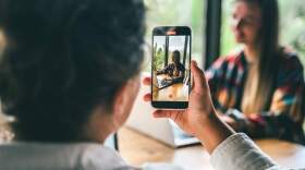 Two bloggers create a vertical video. (Yana Iskayeva/Getty Images)